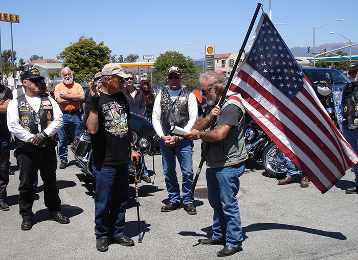 Taking the oath as the flag is transferred 